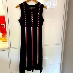 Classy black dress with red and white criss/ cross lace up ribbon/ strings.